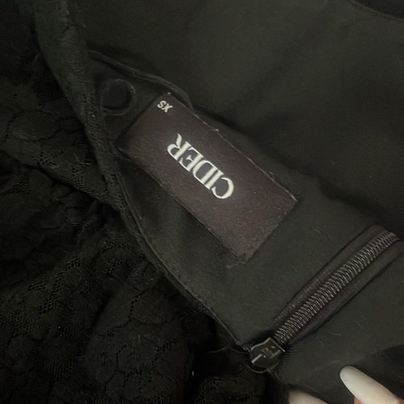 Black Lace mini skirt with built in shorts. Size XS from cider. - Picture 2 of 3